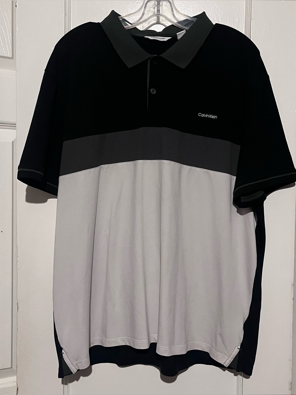 Half black and half white Calvin Klein three button polo xl in mens